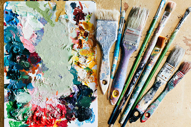 istock Brushes with palette in the creative background. Colorful element. 615497322