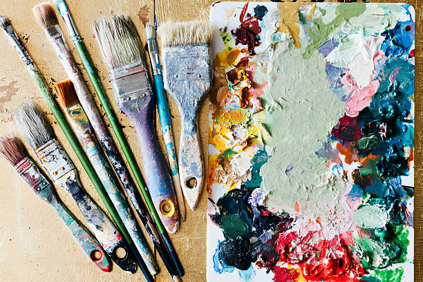 istock Brushes with palette in the creative background. Colorful element 615497482