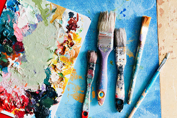 istock Brushes with palette in the creative background. Colorful element 615497862