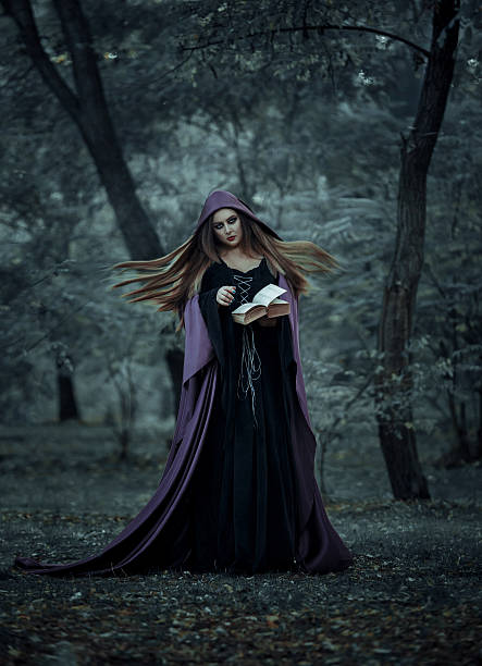 istock The wicked witch in a long dark cloak. 615498604