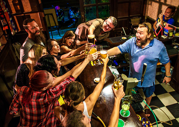friends partying in the bar - irish culture beer drinking pub imagens e fotografias de stock