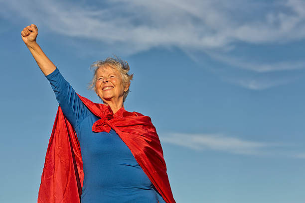 istock senior woman superhero 615500548