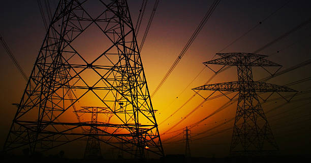 istock Electricity Pylons over sunset 615500702