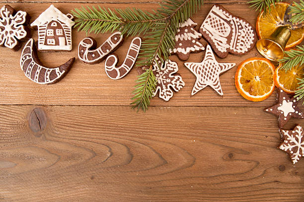 istock Christmas gingerbread cookies on old wooden table. 615504010