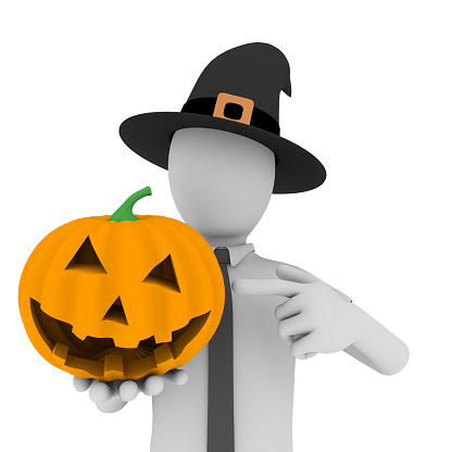 a man with a witch hat pointing to an scary halloween pumpkin
