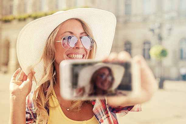 istock Beautiful stylish girl making selfie 615509232