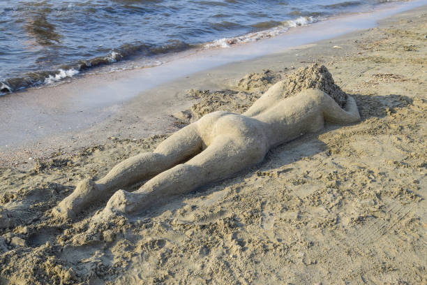 The girl from the sand. Fashioned rest on the sea sand girl.