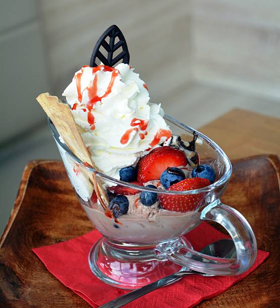 istock Fresh fruits with ice and whipped cream. 615512970