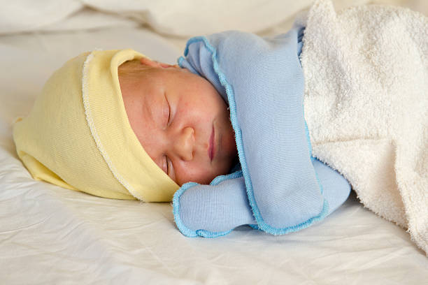 istock Newborn baby asleep 615513256