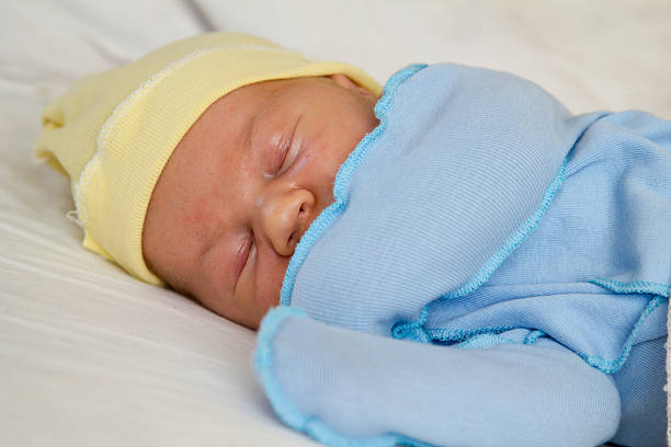 istock Newborn baby age 2 weeks asleep 615513316