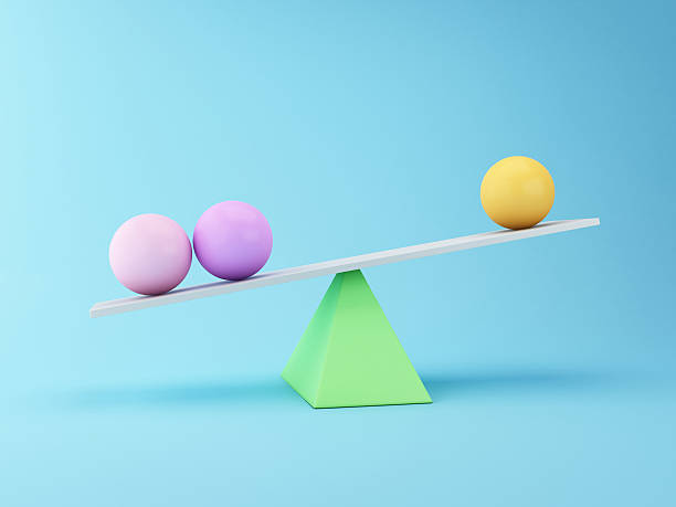 istock Spheres 3d Balancing on a Seesaw. Business concept. 615513816
