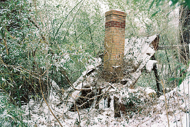 The smoke comes out of the chimney in winter in severe frost