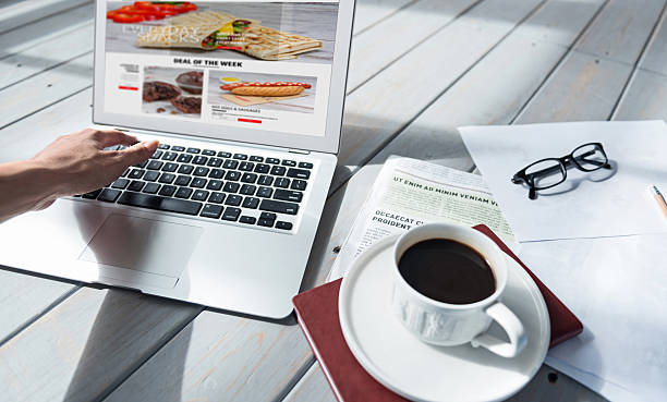 istock Close up of woman using laptop on floor 615517900