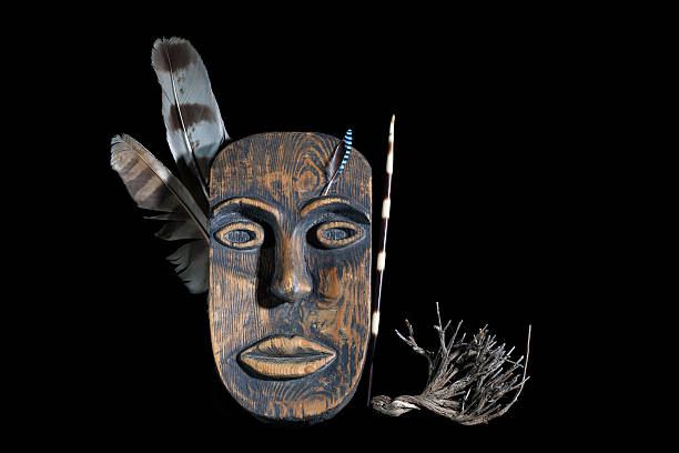 istock decorative mask with feather of warrior on a black background 615518276