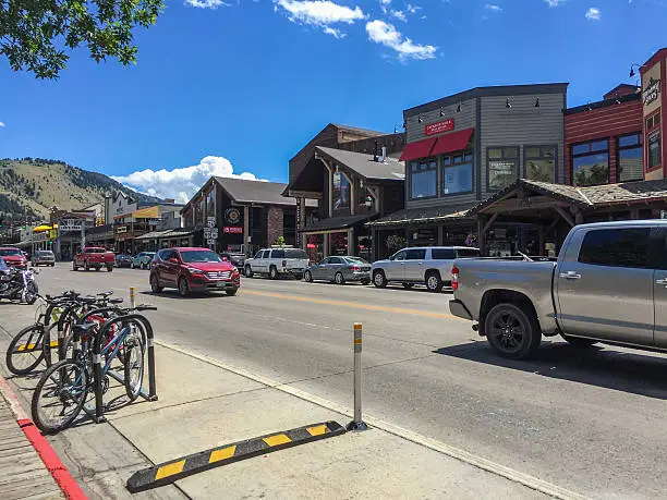 Photo of Jackson, Wyoming. Street with old houses and cars