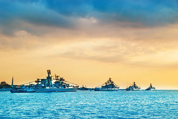 istock Military navy ships in a sea bay 615519738