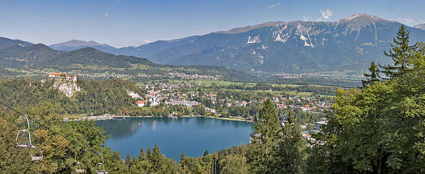 istock Panorama of Bled lake, medieval castle and Alps in Slovenia. 615519800