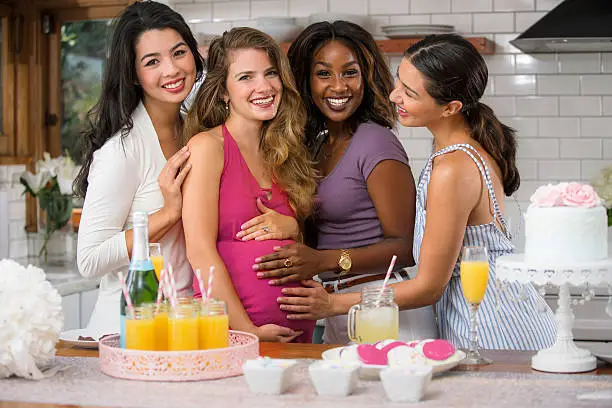 Group of women friends celebrating life love happiness friendship with cocktails mimosa brunch Baby shower fun with mimosa cocktail diverse group women friends mixed multiple ethnicities