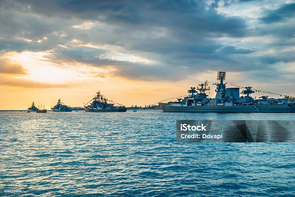 Military navy ships in a sea bay Military navy ships in a sea bay at sunset time Navy Stock Photo