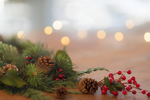 istock Holiday table decorations with pinecones and holly berries 615521368