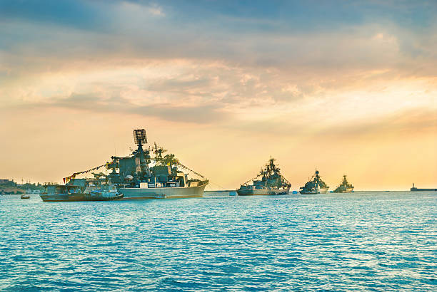 istock Military navy ships in a sea bay 615521910