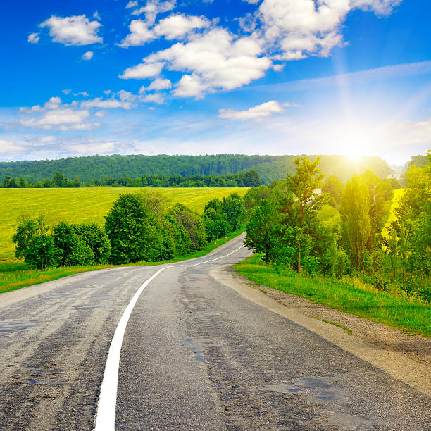 istock country road and beautiful sunset 615521944