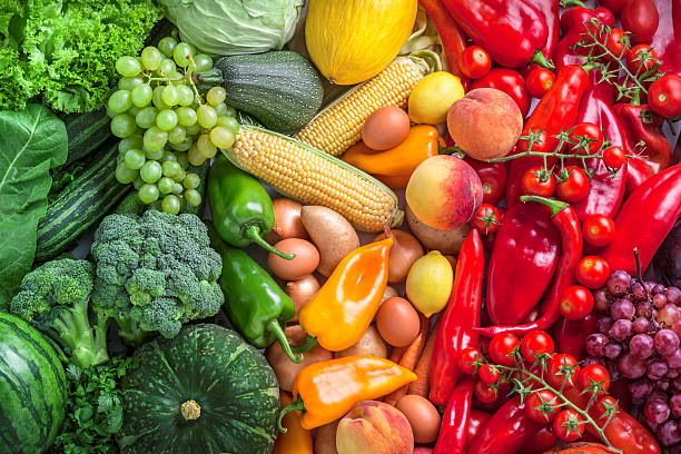 Fruits and vegetables overhead assortment on colorful background Fruits and vegetables overhead assortment colorful background green, yellow to red large group of objects stock pictures, royalty-free photos & images