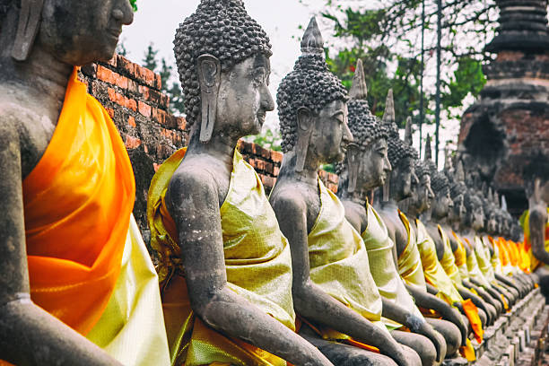 istock Rows of buddha statue Wat Yai Chaimongkhon, Ayuthaya, Thailand 615524856