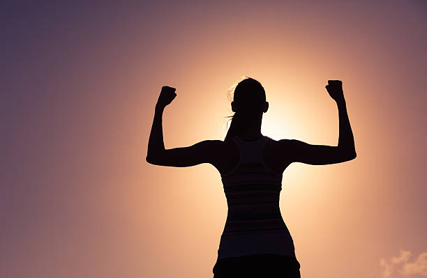 girl power! - human muscle women flexing muscles female - fotografias e filmes do acervo