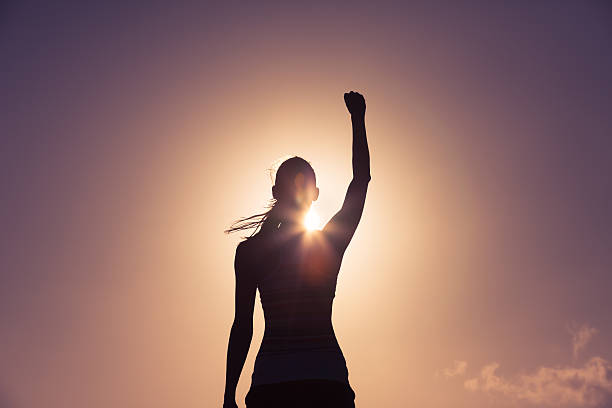 Winner Strong confident woman.  arms raised stock pictures, royalty-free photos & images