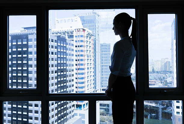 istock Woman in he office looking out the window. 615525026