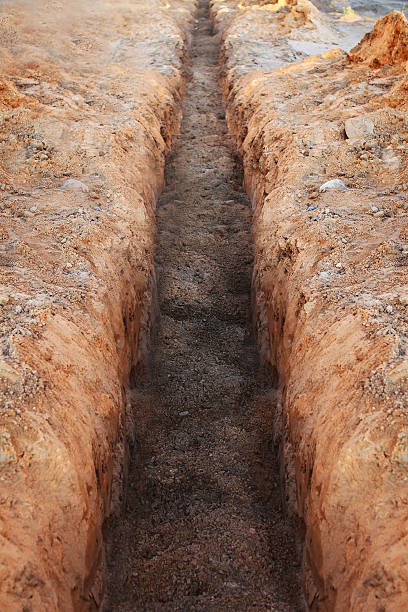 Earthworks, digging trench stock photo