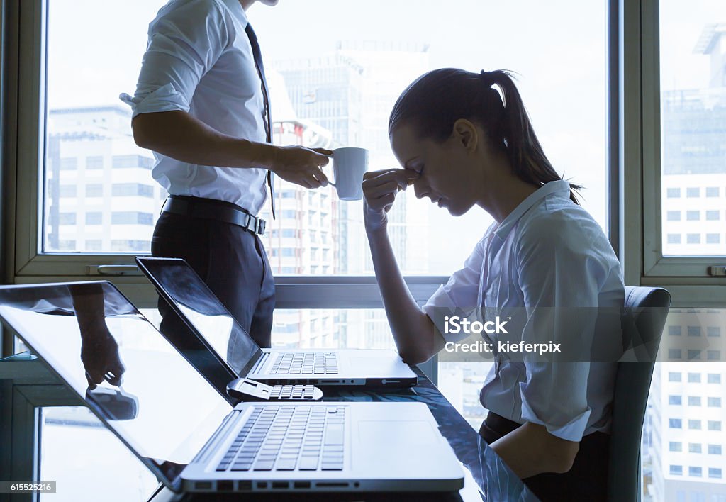 Depressed business people in the office Silhouettes of depressed business people in the office. Women Stock Photo