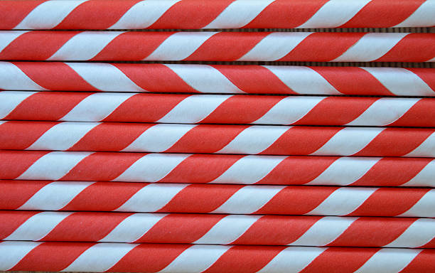 istock Red and White striped party straws 615525220