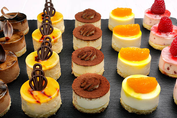 istock Catering set cookies on stone black background 615594836