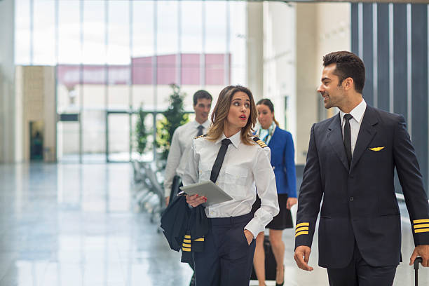 istock Woman Flight Captain and her crew 615595716