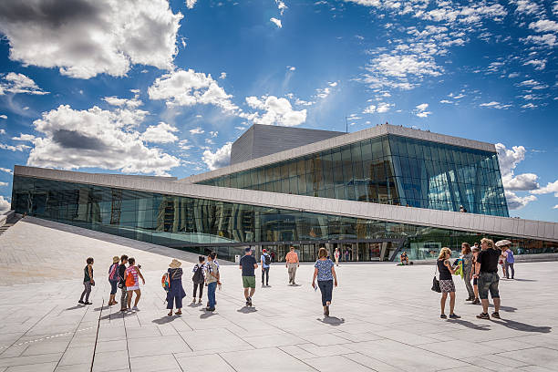 Oslo, Norway - July 18, 2016: Tourists exploring Oslo Opera House, Norway