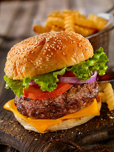 istock Deluxe Cheeseburger with a Basket of Fries 615596204