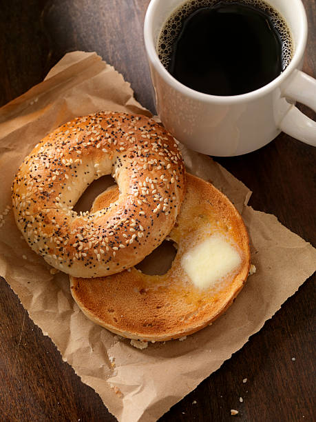 istock Toasted Bagel with Butter and a Coffee 615596980