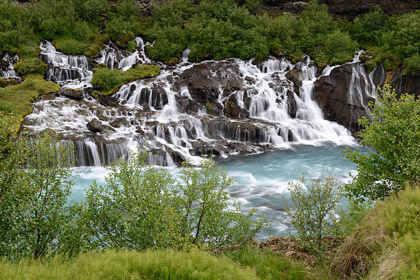Scenery of Hraunfossar and Barnafoss in Iceland Waterfalls from volcanic rocks at Hraunfossar, Iceland hraunfossar stock pictures, royalty-free photos & images