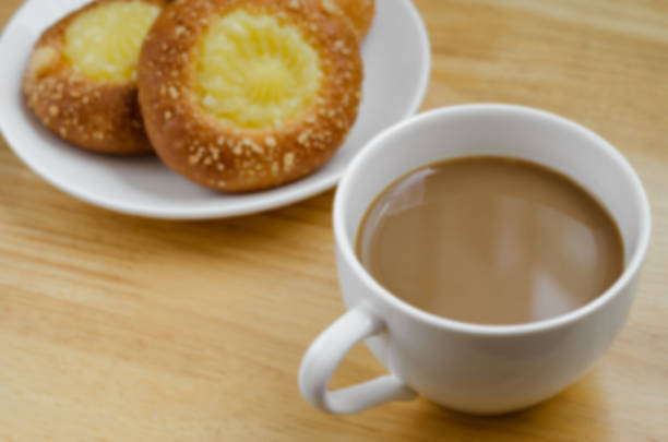 istock Coffee and Custard Bun for Coffee Break (blurry background). 615601230