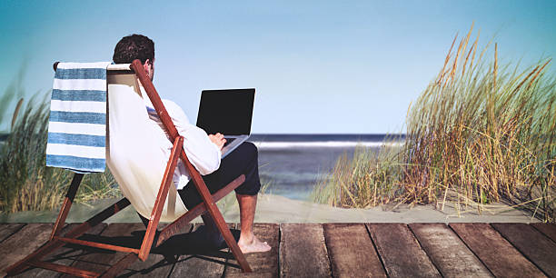 istock Businessman Working Summer Beach Relaxation Concept 615601480