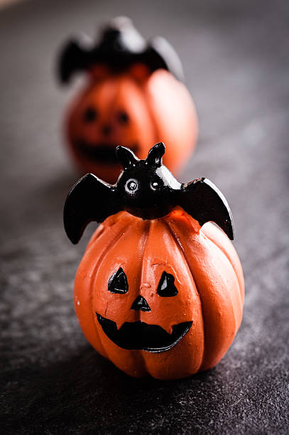 istock Halloween pumpkin decoration on black background 615603474