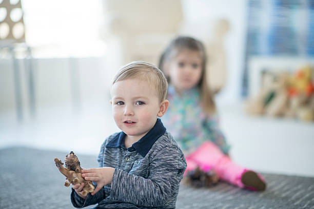 istock Playing Together in Preschool 615607382