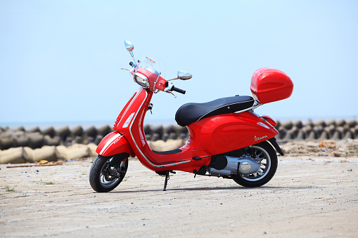 Namdinh, Vietnam - May 21, 2015: Vespa Sprint all new motorcycle on the test drive, sea beach area in Vietnam.