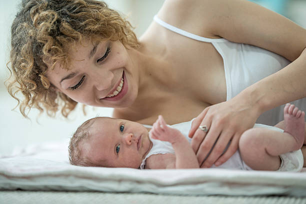 istock Happy Mother with Her Baby 615607822