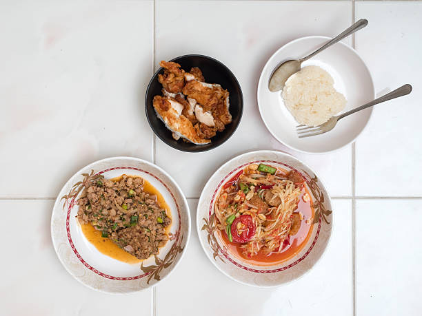 istock Papaya salad with Spicy minced pork,Fried chicken 615608890