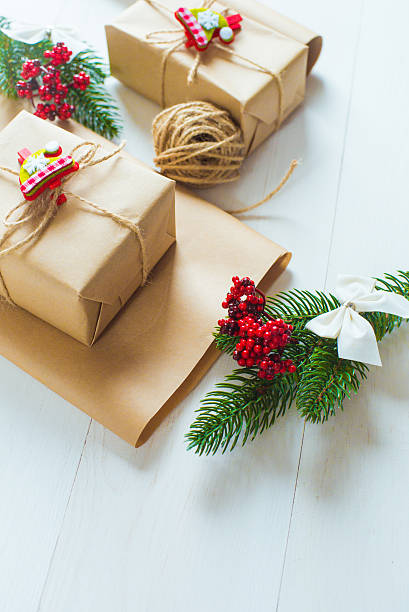istock Christmas gift and a sprig of pine needles 615614002