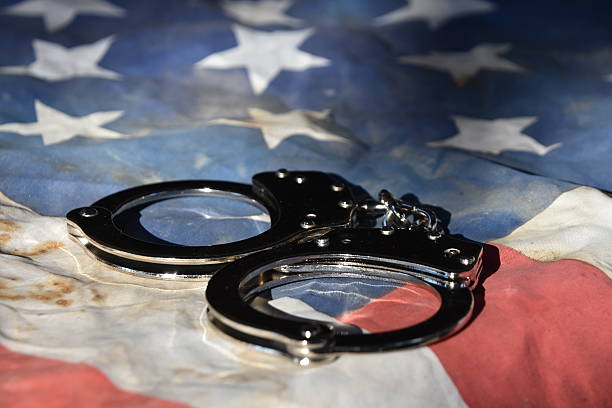 istock American Justice Handcuffs on Flag 615617270