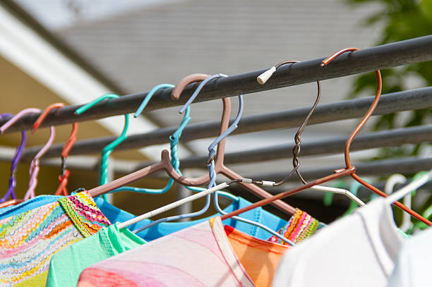 istock Shirts hanging on hangers old 615617436